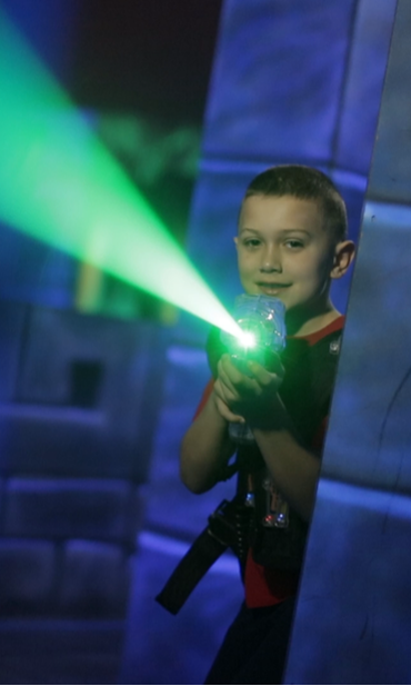 Kid Smiling While Playing Laser Tag