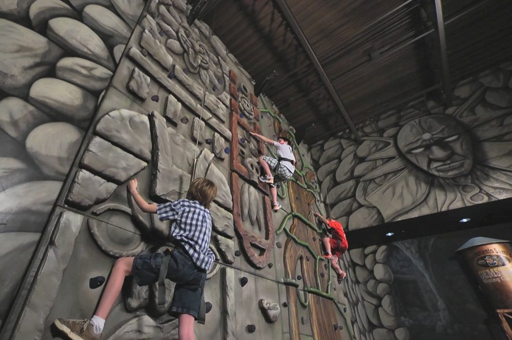 Kids Climbing Indoor Rock Wall at Nomads Adventure Quest